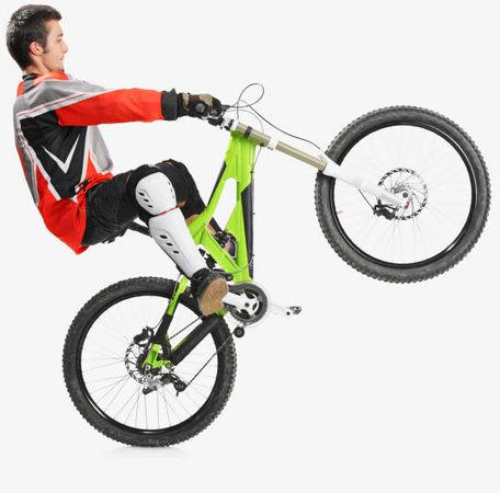 Young biker with his mountain bike jumping isolated on white background